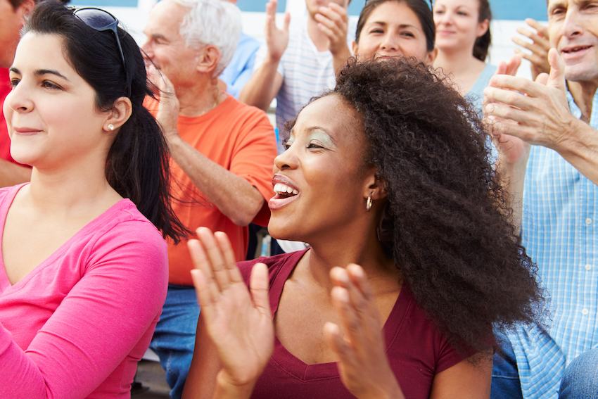 outdoor event with people cheering