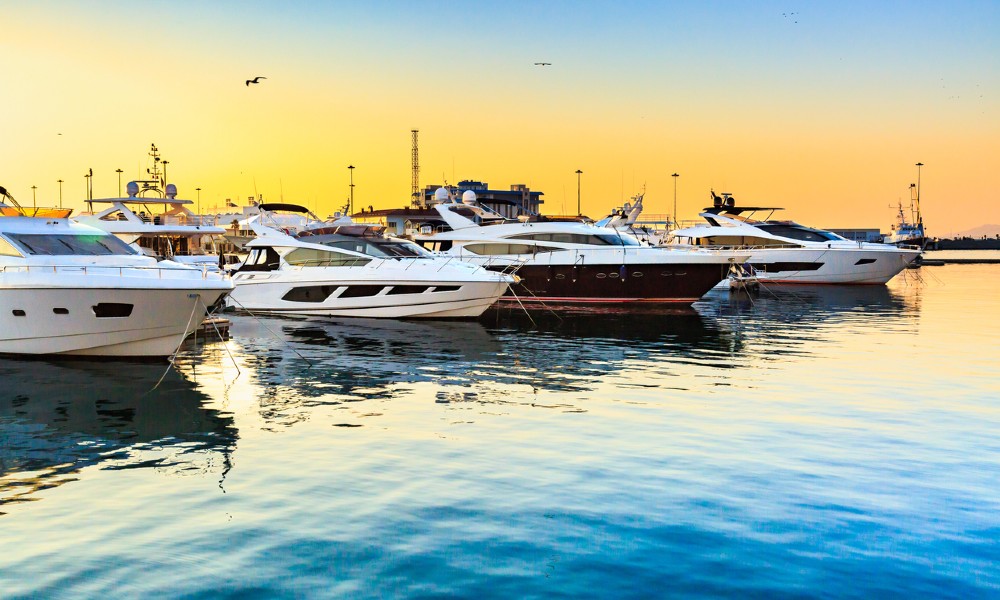 Boats are docked at a marina, highlighting the need for marina security to prevent unauthorized visitors from accessing them.